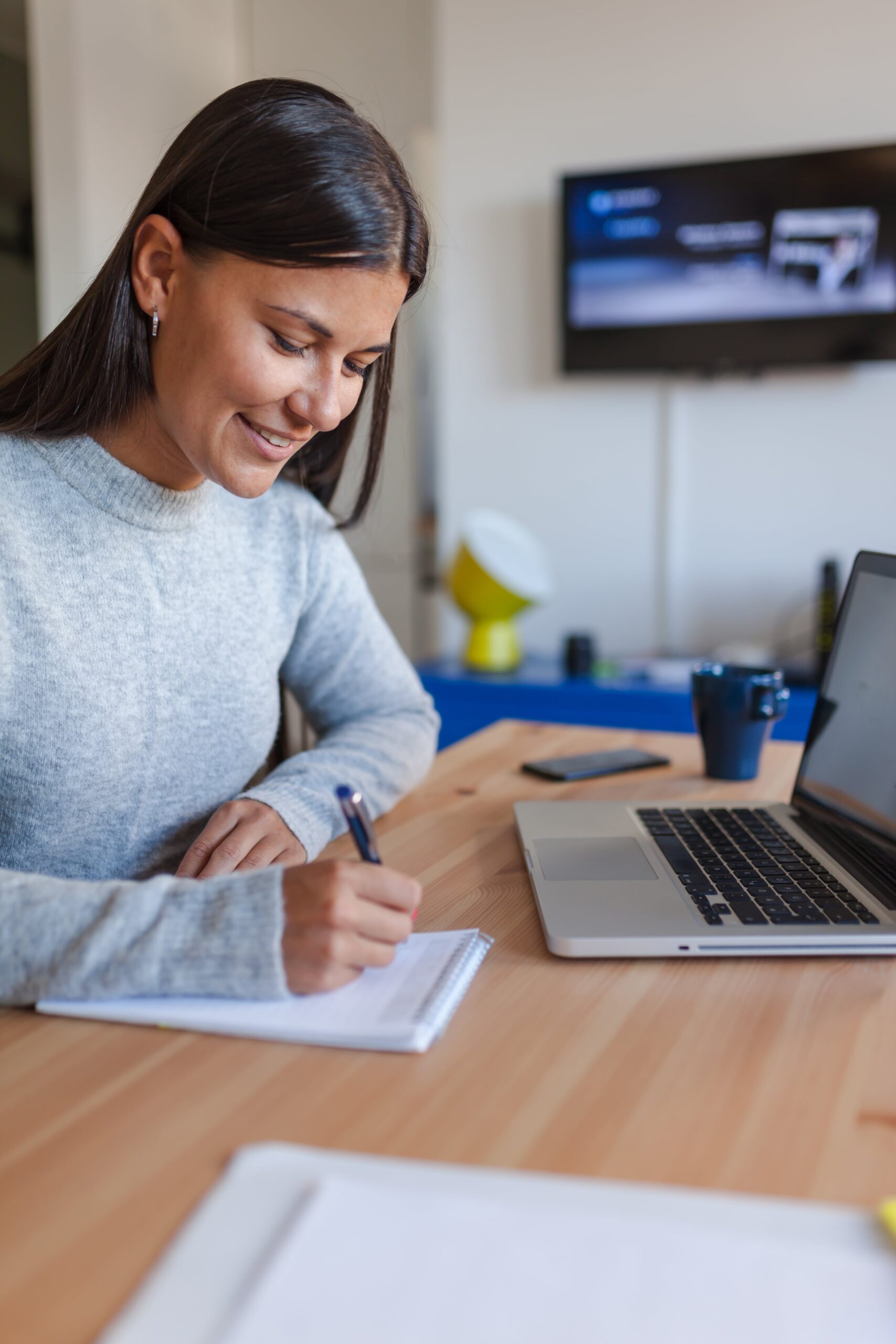 smiling-woman-working-home-min